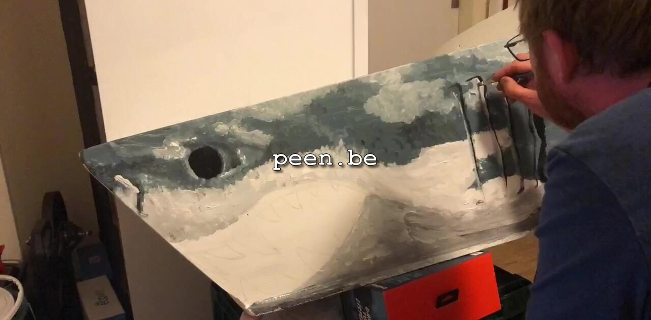 Pieter painting a shark on his cargobike